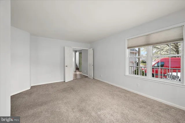 a spacious bathroom with a double vanity sink mirror and bathtub