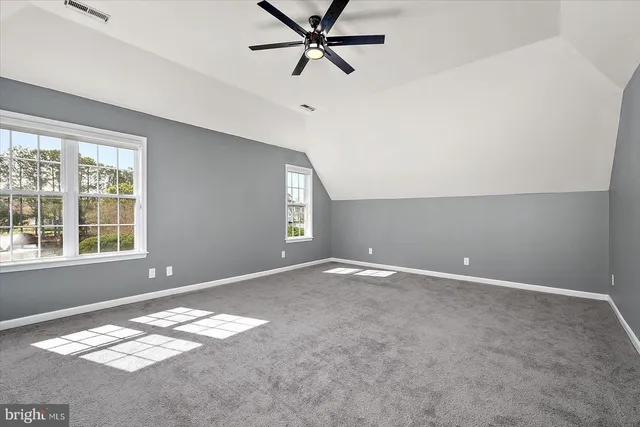a view of a balcony with wooden floor