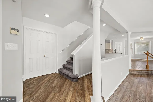 a view of a livingroom with wooden floor and window