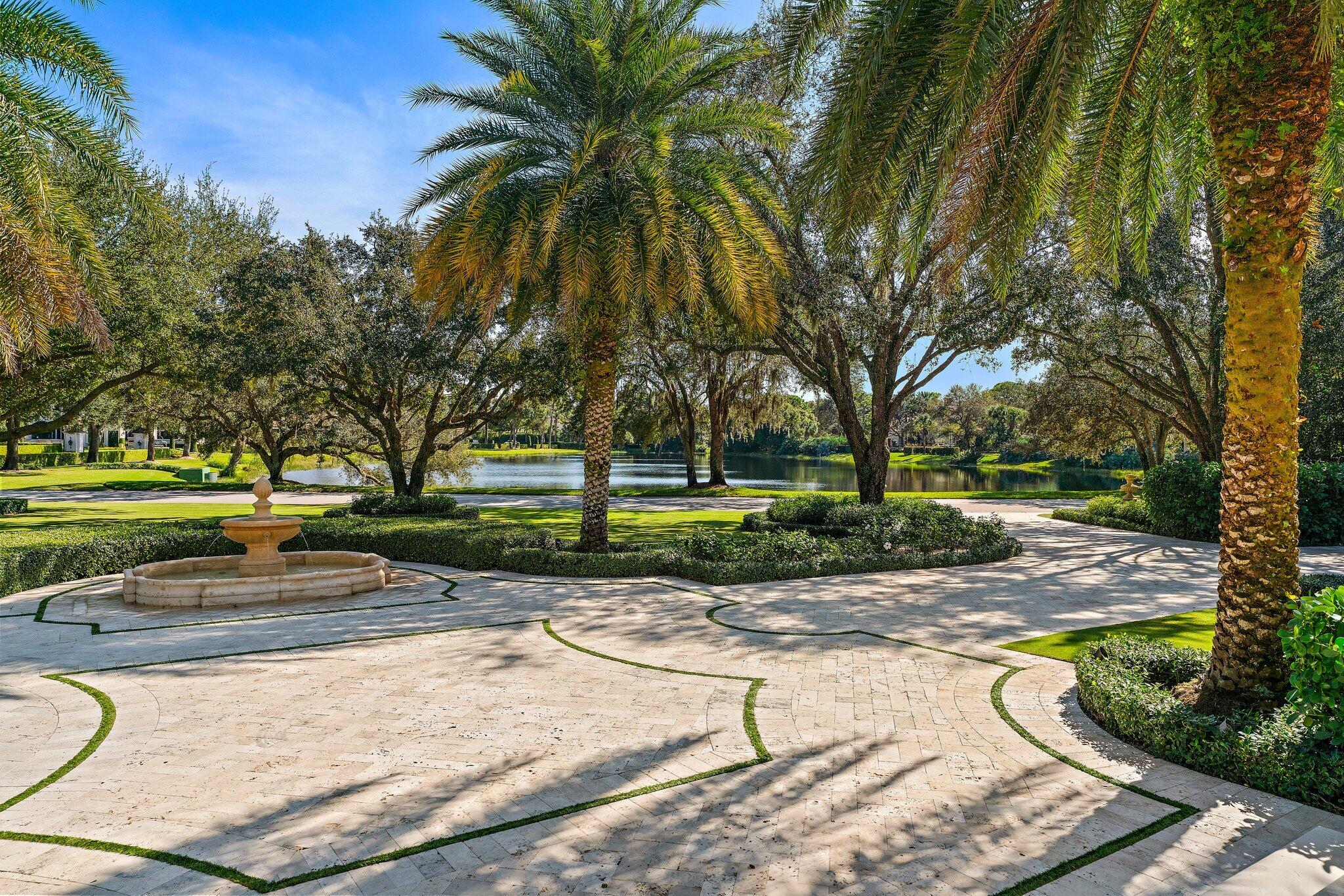 146 Bears Club Drive Jupiter, FL 33477 - Photo 12 of 115 View to Yard and Lake from Front Steps