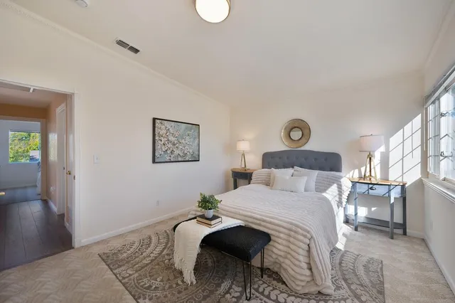 a bed room with a bed and a lamp