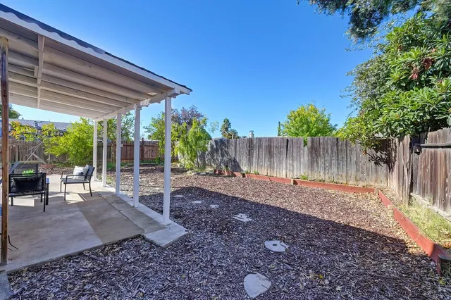 a patio with table and chairs