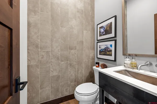 a bathroom with a toilet a sink and a shower