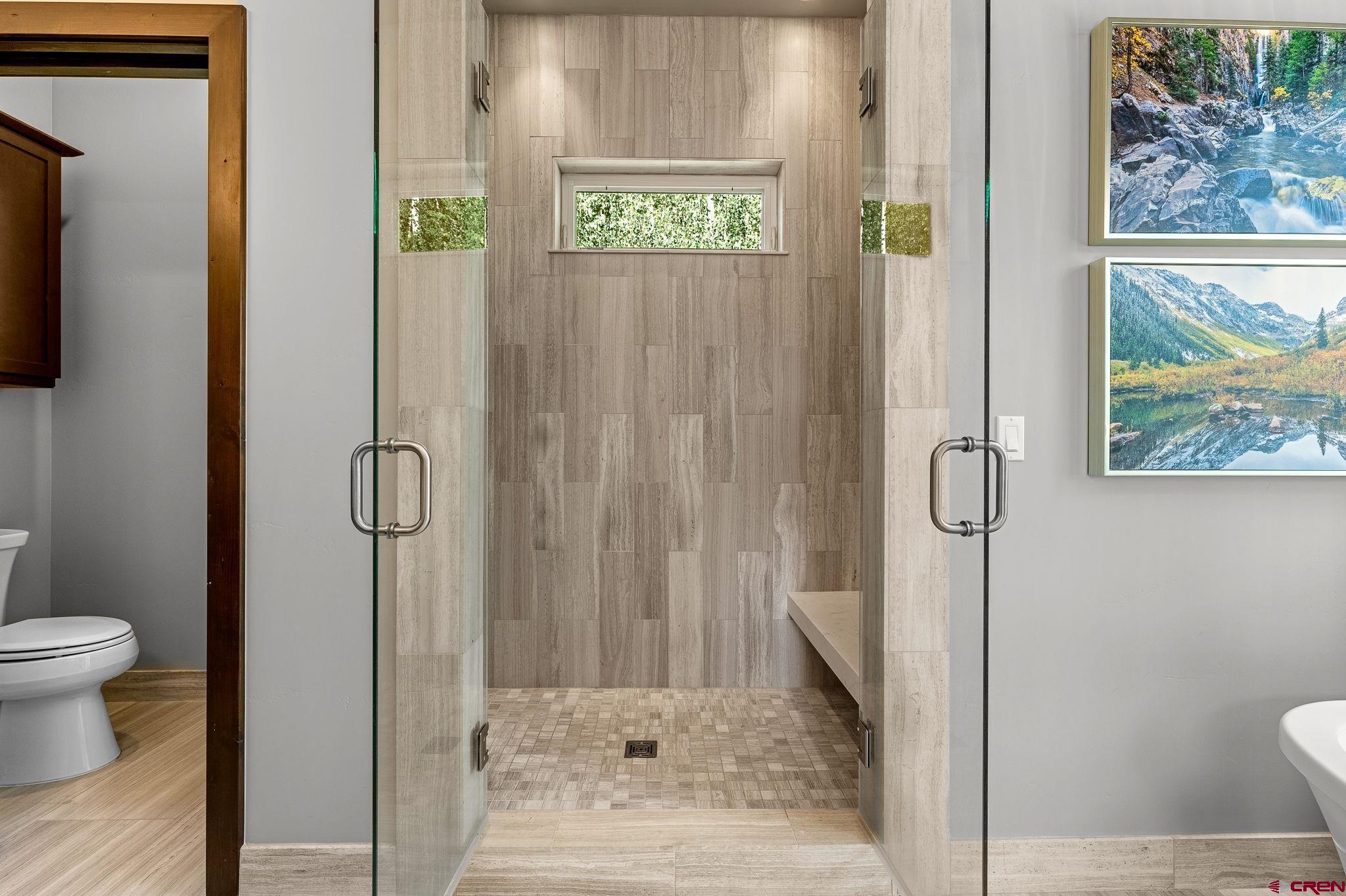155 Long Story Road Durango, CO 81301 - Photo 11 of 45 a bathroom with a toilet and a shower