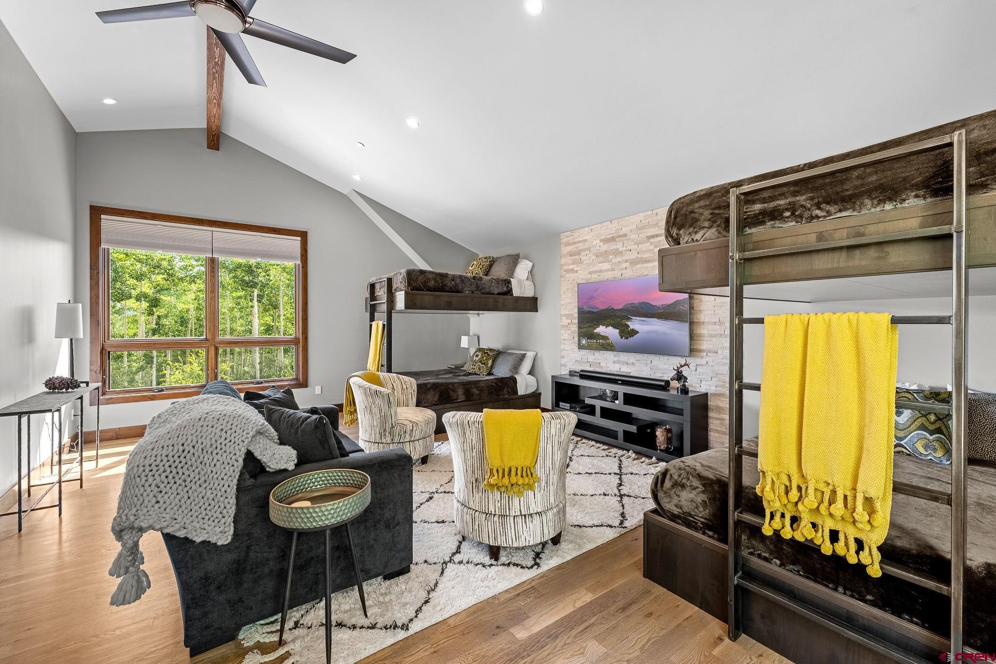 155 Long Story Road Durango, CO 81301 - Photo 44 of 45 a living room with furniture and a flat screen tv