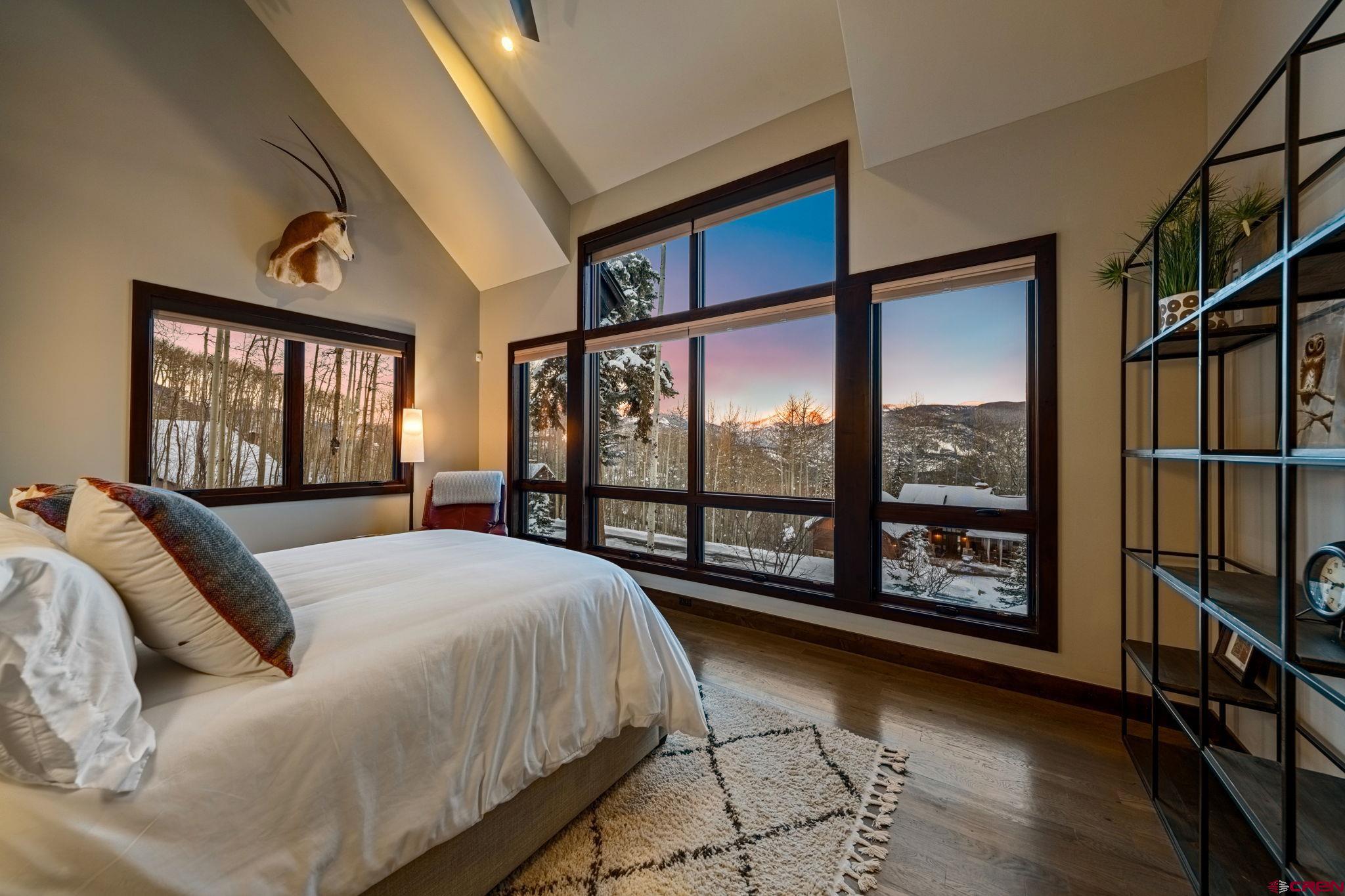 155 Long Story Road Durango, CO 81301 - Photo 7 of 45 a bed sitting in a bedroom next to a window