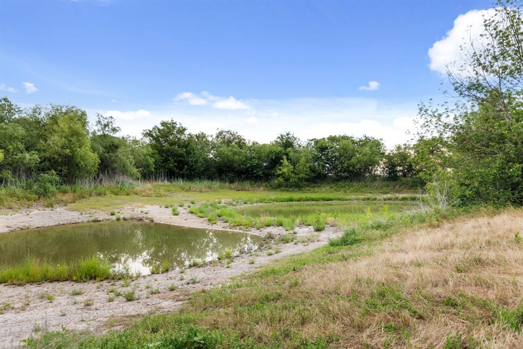 300 Grellhesl Road West, TX 76691 - Photo 31 of 35 a view of a lake from a yard