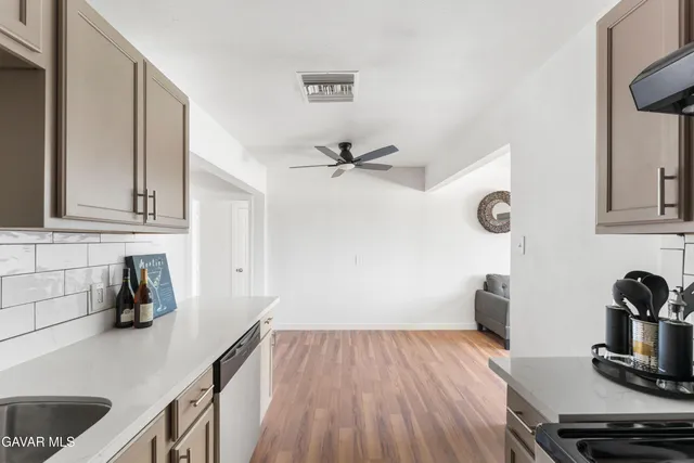 a kitchen with a stove and a refrigerator