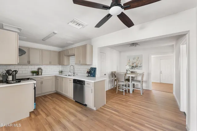 a view of a living room and hardwood floor