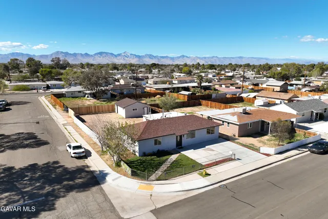 a swimming pool with yard and stairs in the back