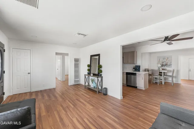 a view of a dining room with furniture and wooden floor