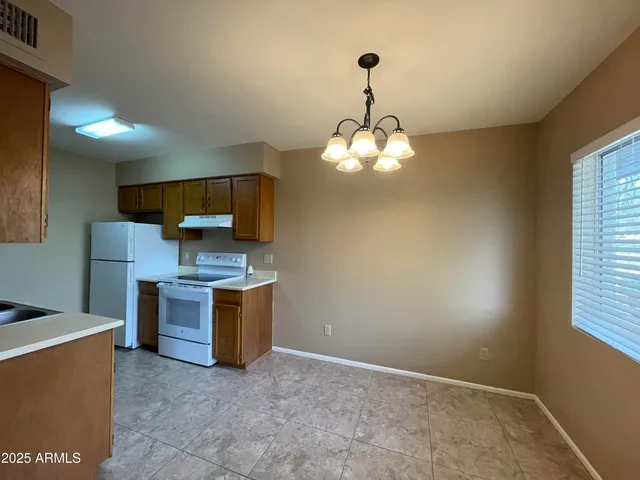 a view of a kitchen with microwave and stove