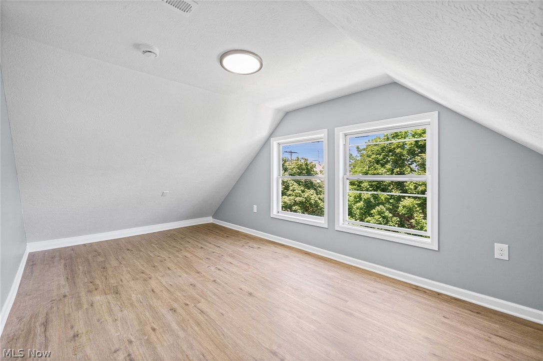 3925 Riverside Avenue Cleveland, OH 44109 - Photo 38 of 48 Room featuring wood-finish flooring, white baseboards, and light gray walls