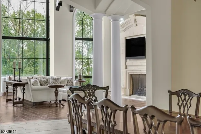 a living room with furniture and a floor to ceiling window