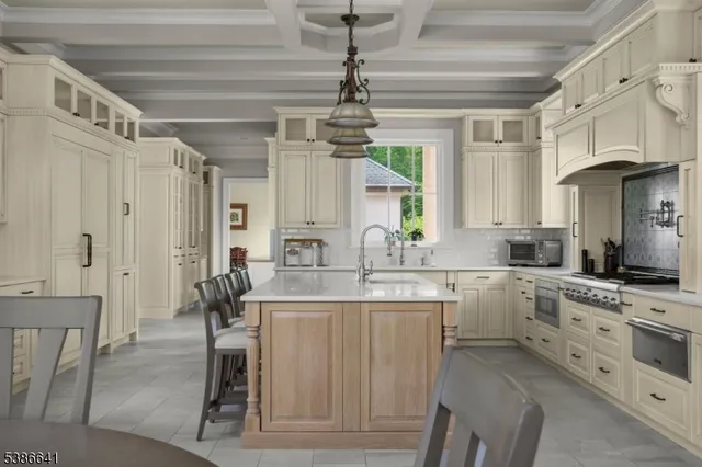 a kitchen with a cabinets and chairs