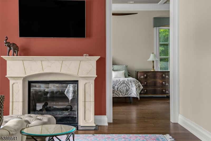 4 Mason Hill Road Warren, NJ 07059 - Photo 27 of 50 a living room with furniture and a fireplace
