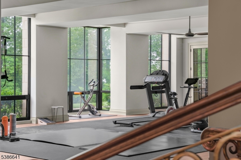 4 Mason Hill Road Warren, NJ 07059 - Photo 37 of 50 a room with a large window and potted plants