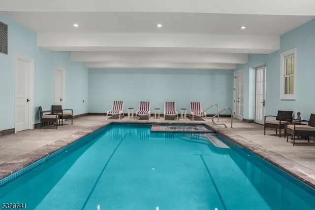 a living room with kitchen island furniture and a wooden floor