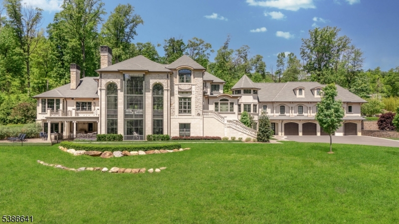 4 Mason Hill Road Warren, NJ 07059 - Photo 6 of 50 a front view of a house with a yard table and chairs