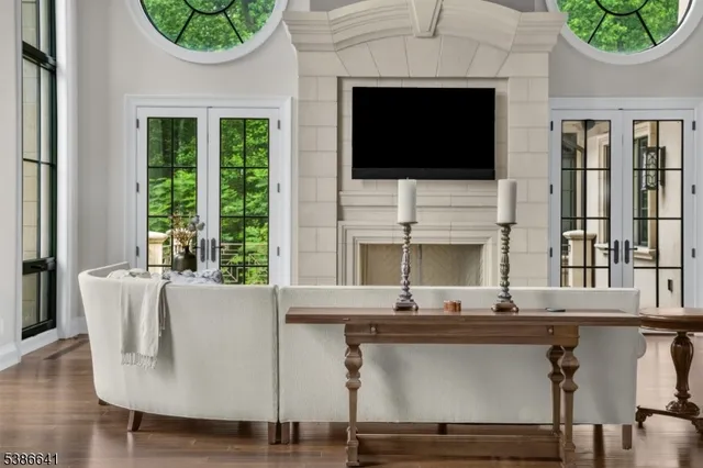 a living room with fireplace furniture and a flat screen tv