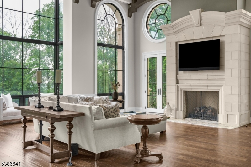 4 Mason Hill Road Warren, NJ 07059 - Photo 10 of 50 a living room with furniture a fireplace and a flat screen tv