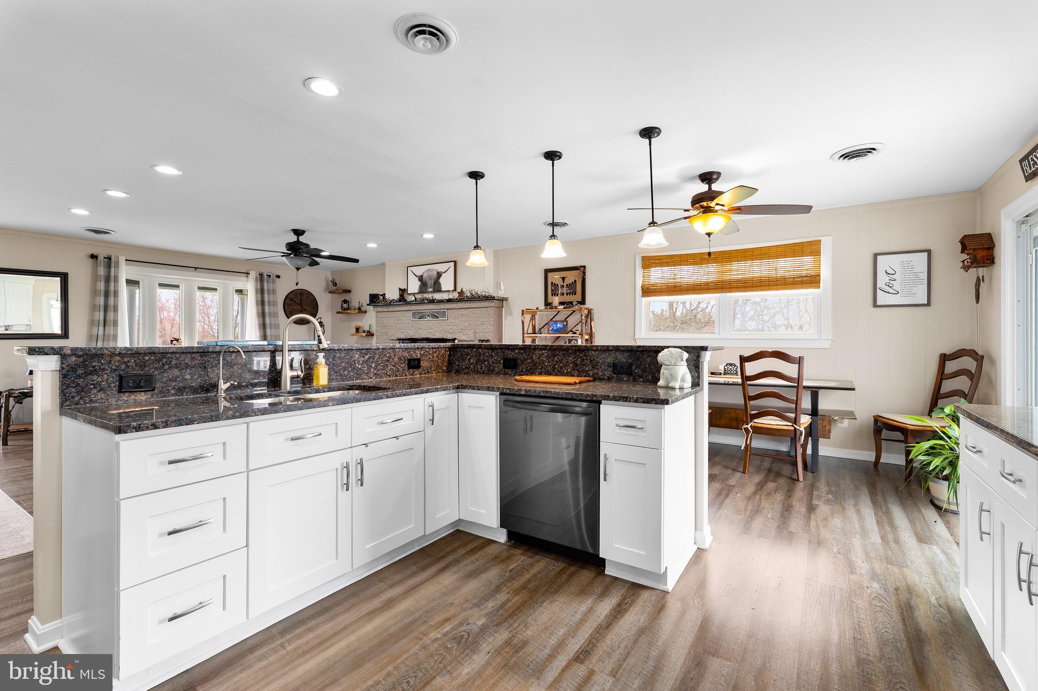 144 Bill Leight Road Conowingo, MD 21918 - Photo 11 of 28 a kitchen with granite countertop white cabinets and appliances