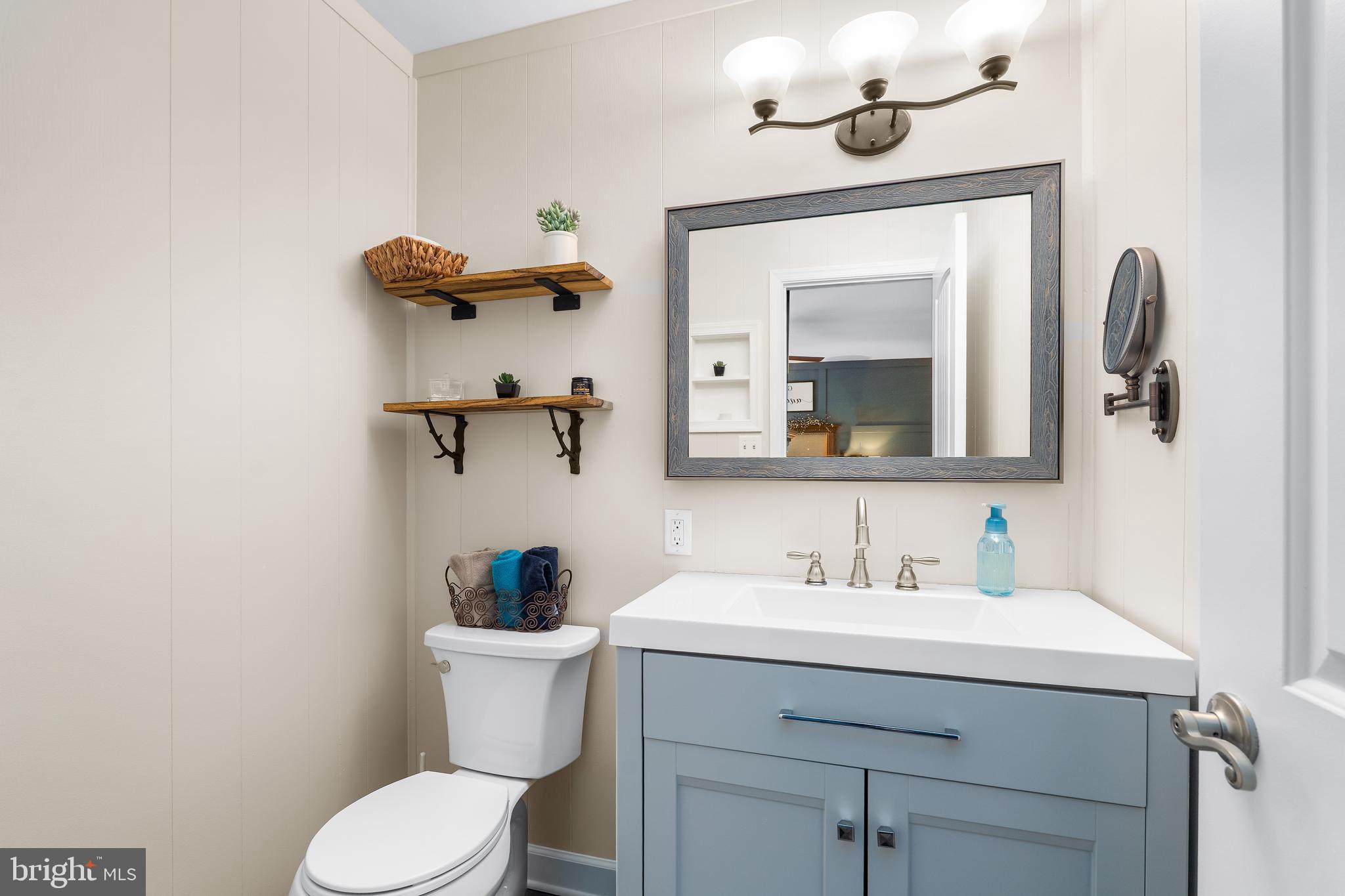 144 Bill Leight Road Conowingo, MD 21918 - Photo 16 of 28 a bathroom with a sink vanity and toilet
