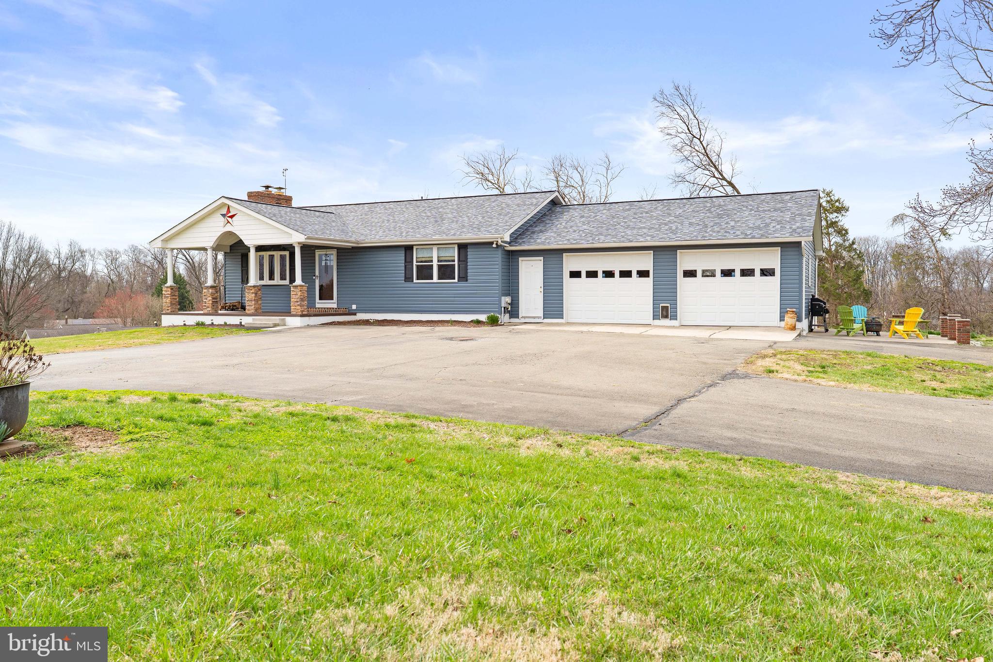 144 Bill Leight Road Conowingo, MD 21918 - Photo 2 of 28 a front view of a house with a yard and garage