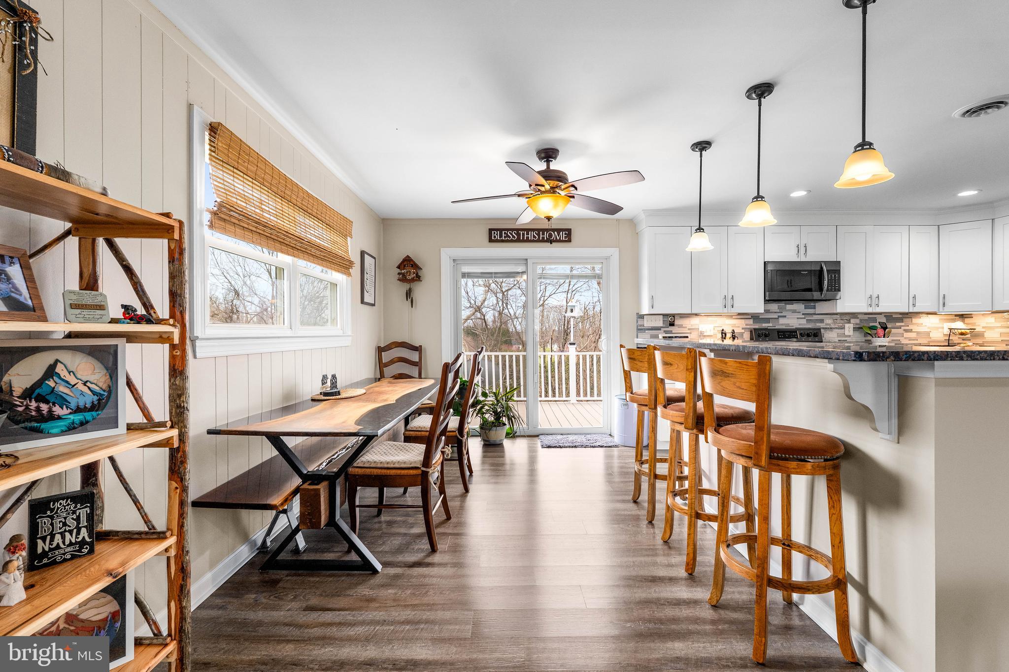 144 Bill Leight Road Conowingo, MD 21918 - Photo 8 of 28 a view of a dining room with furniture a chandelier and wooden floor