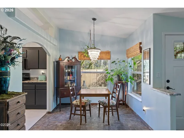 a view of a dining room with furniture window and outside view