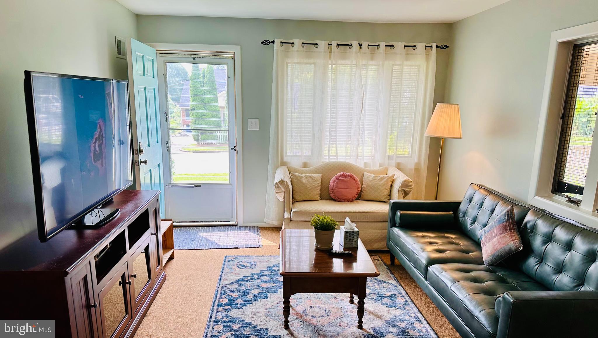 1813 Olmstead Drive Falls Church, VA 22043 - Photo 14 of 14 a living room with furniture and a window