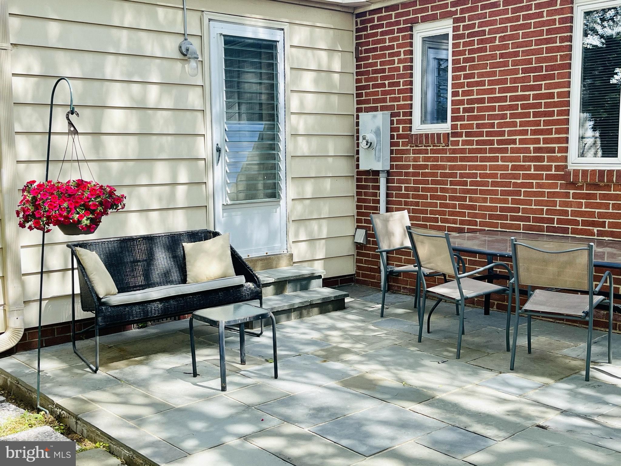 1813 Olmstead Drive Falls Church, VA 22043 - Photo 2 of 14 a building outdoor space with patio furniture