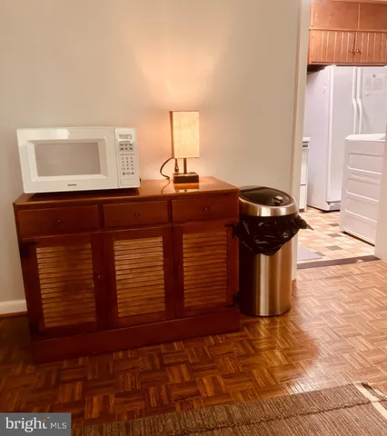 a room with a dresser and a window