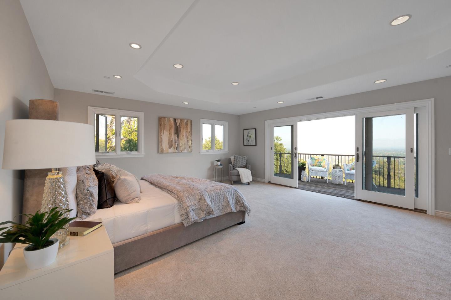 21401 Prospect Road Saratoga, CA 95070 - Photo 19 of 26 a spacious bedroom with a large bed and a large window