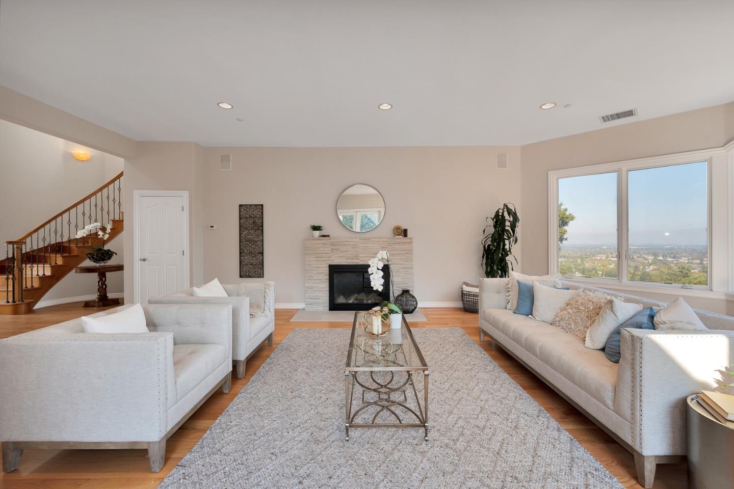 21401 Prospect Road Saratoga, CA 95070 - Photo 6 of 26 a living room with furniture and a large window