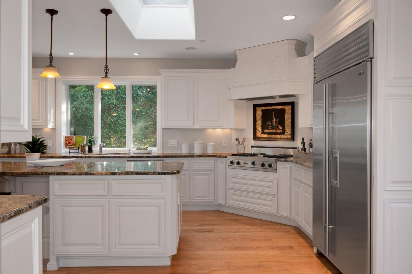 21401 Prospect Road Saratoga, CA 95070 - Photo 9 of 26 a kitchen with white cabinets and appliances