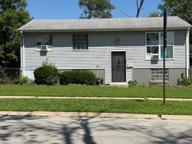1908 Boston Street North Chicago Heights, IL 60411 - Photo 2 of 3 a front view of a house with a yard