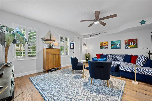 a living room with furniture and a rug