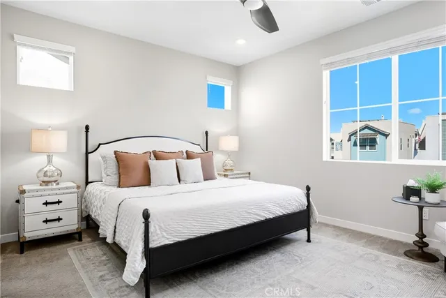 a bedroom with a bed and a television