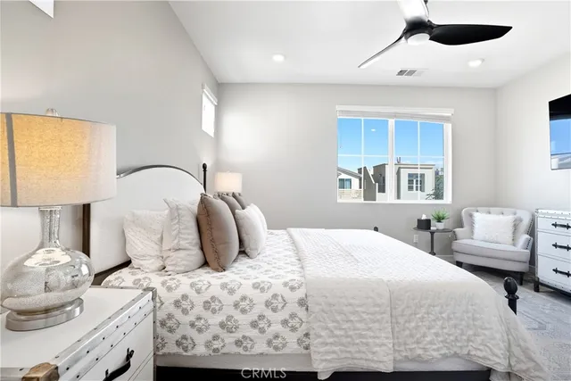 a en suite bathroom with a sink a mirror and shower