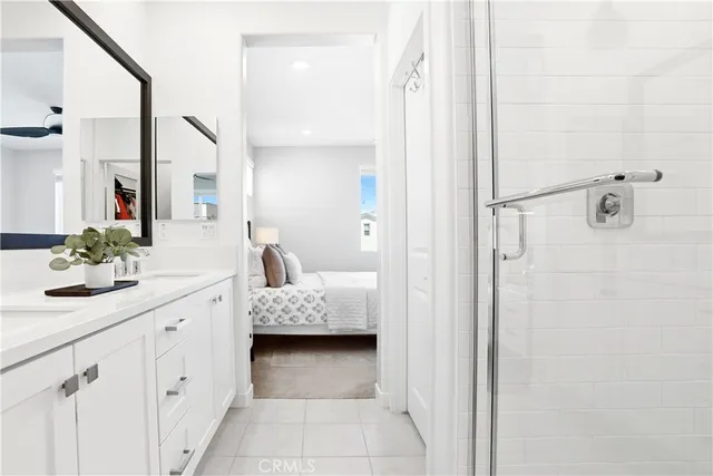 a bathroom with a double vanity sink and a mirror