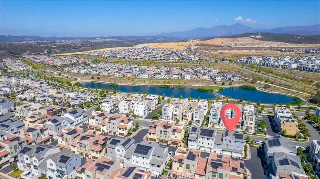 a view of a swimming pool with a table and chairs