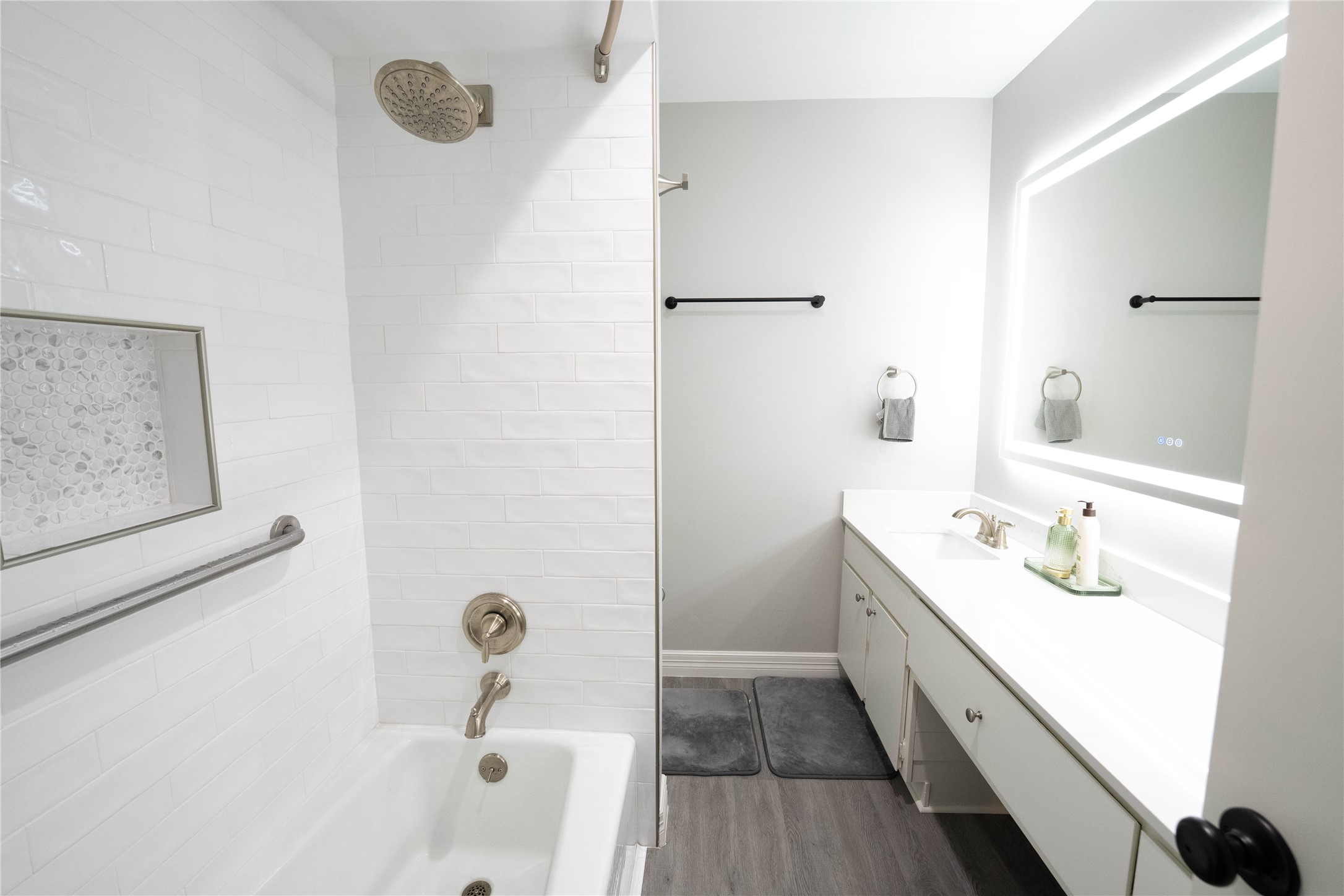 7447 Brompton Street, Unit 7447 Houston, TX 77025 - Photo 23 of 27 Secondary full bath with bathtub shower combo and updated vanity.
