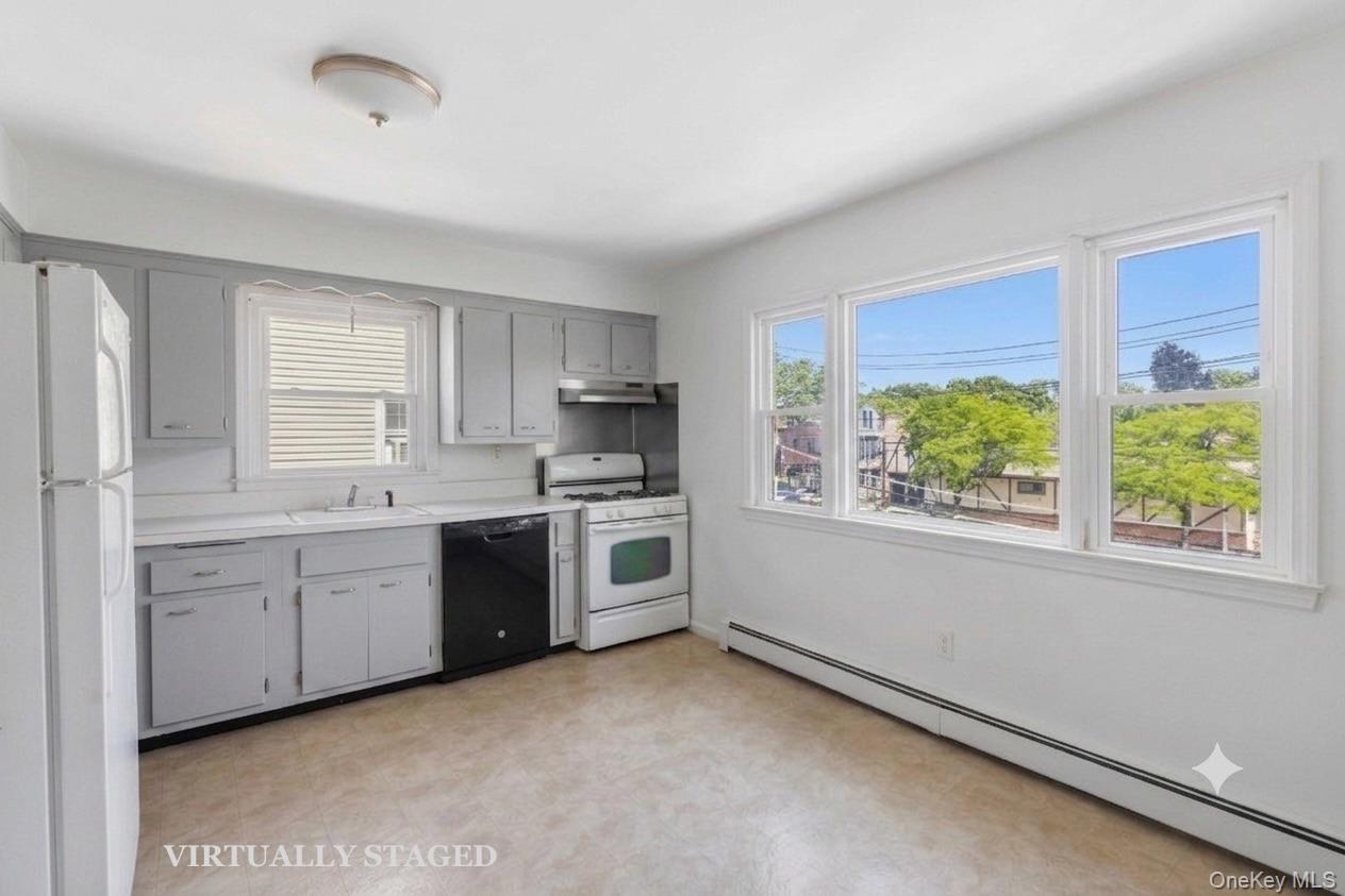 508 New Rochelle Road, Unit 2 Bronxville, NY 10708 - Photo 5 of 18 Kitchen - virtually staged to show new cabinet color after renovation