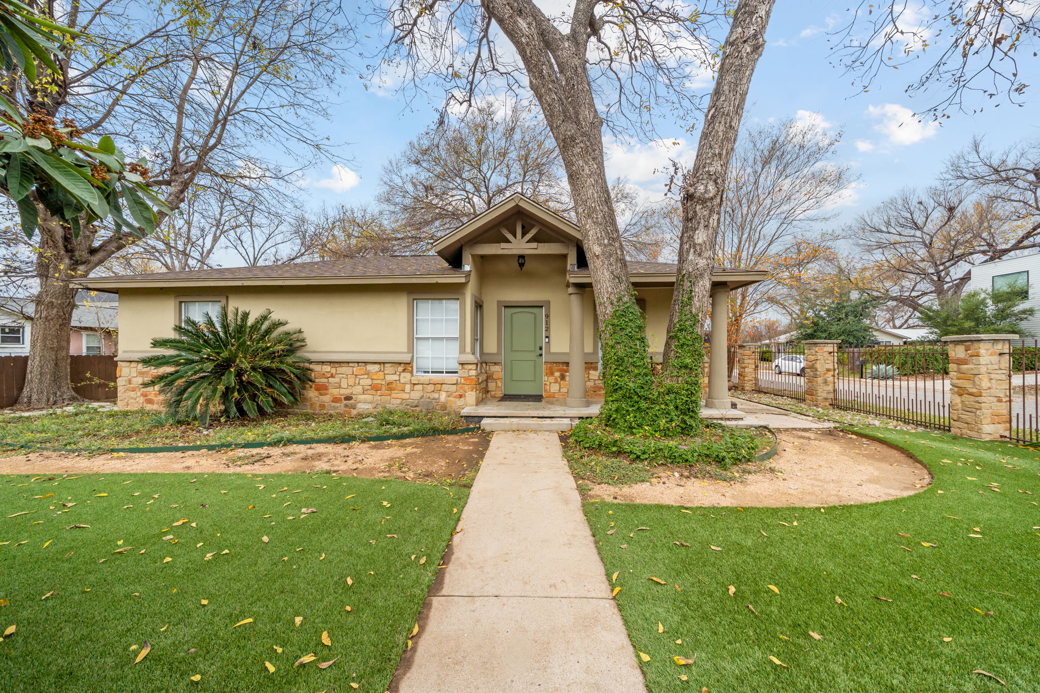 912 Mansell Avenue Austin, TX 78702 - Photo 1 of 37 View of front facade featuring stucco siding and stone siding