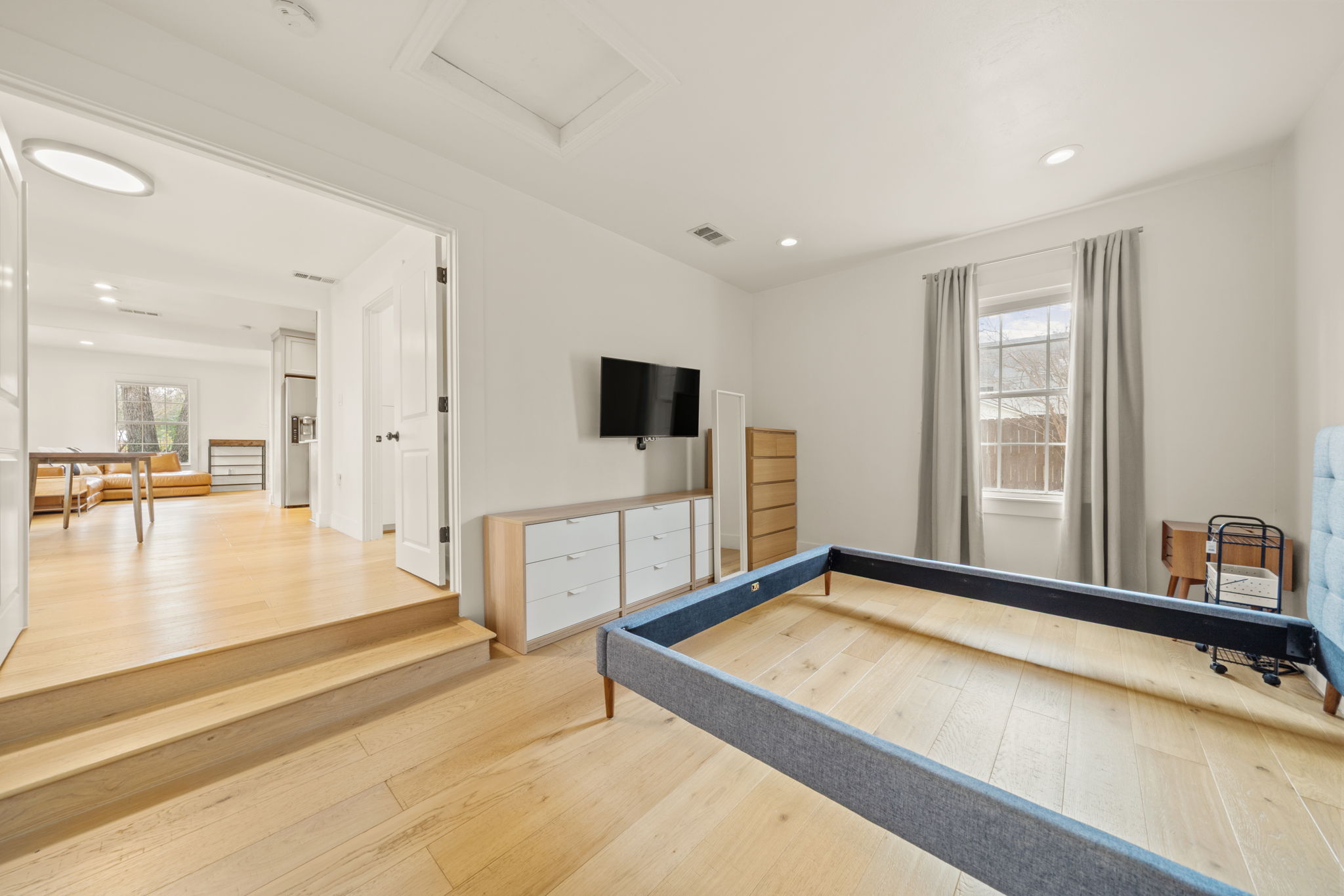 912 Mansell Avenue Austin, TX 78702 - Photo 21 of 37 Rec room featuring light wood-style floors, recessed lighting, and attic access