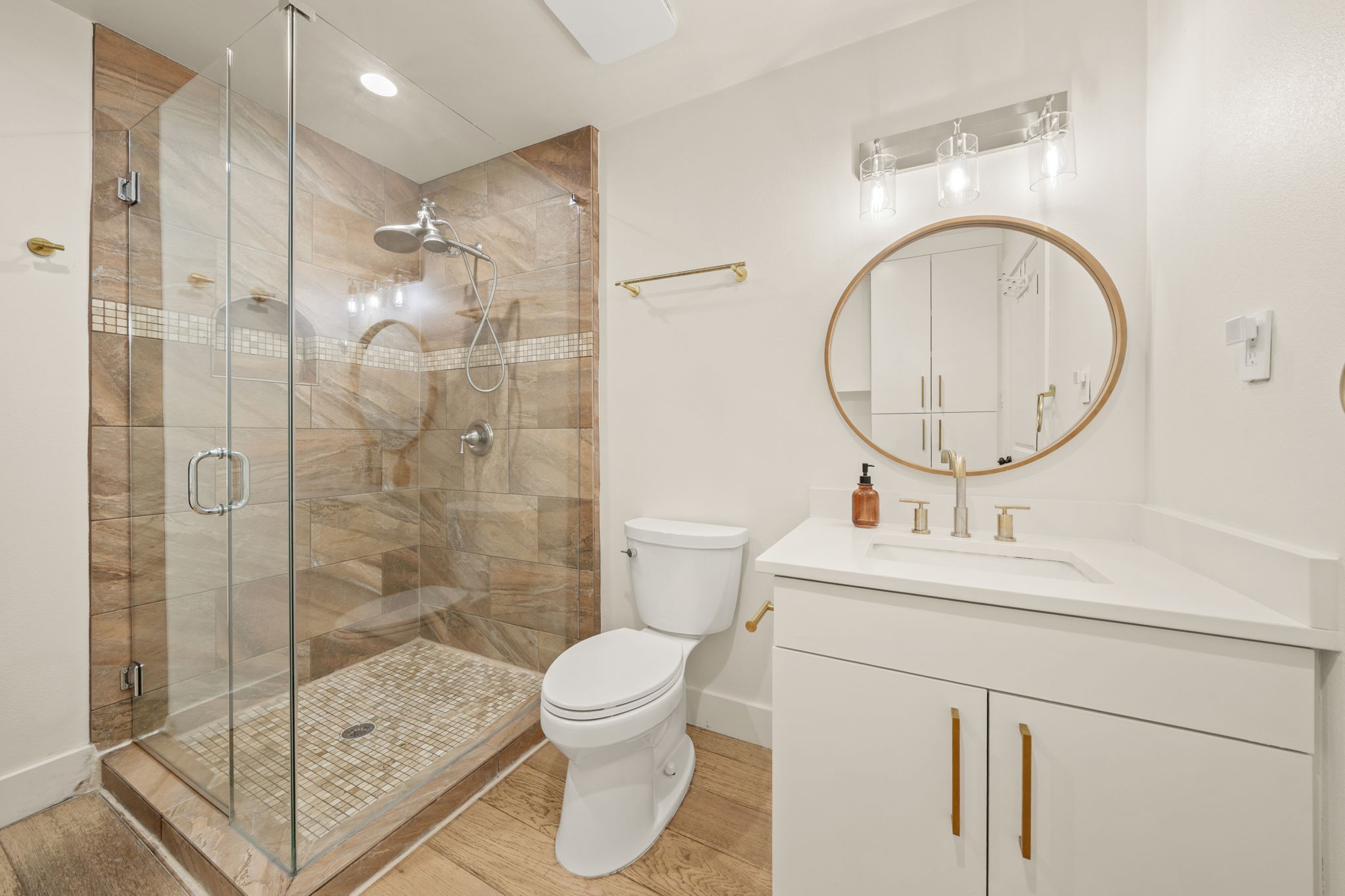 912 Mansell Avenue Austin, TX 78702 - Photo 23 of 37 Full bath featuring vanity and a stall shower