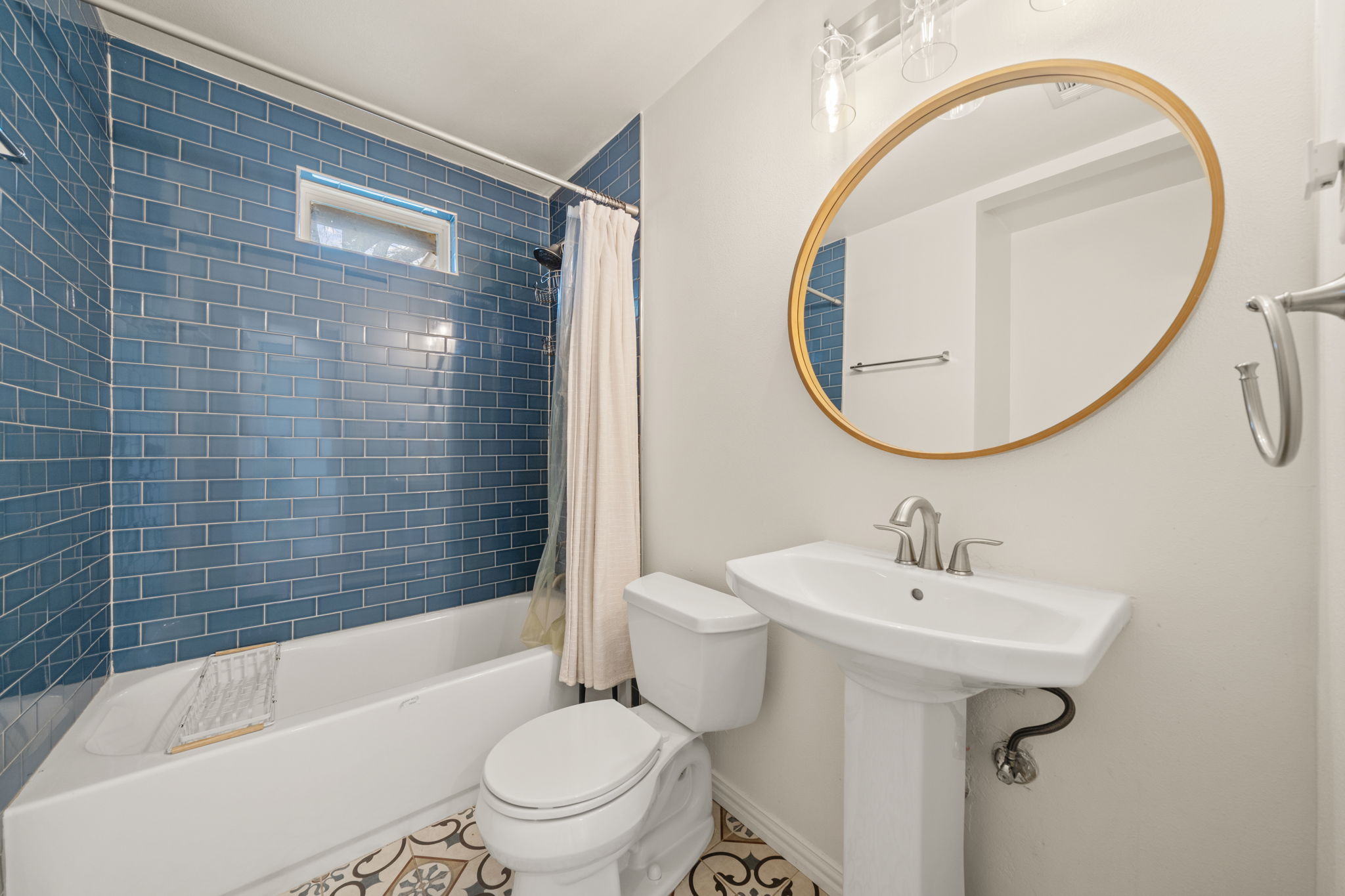 912 Mansell Avenue Austin, TX 78702 - Photo 28 of 37 Full bathroom featuring shower / bath combination with curtain and tile patterned floors