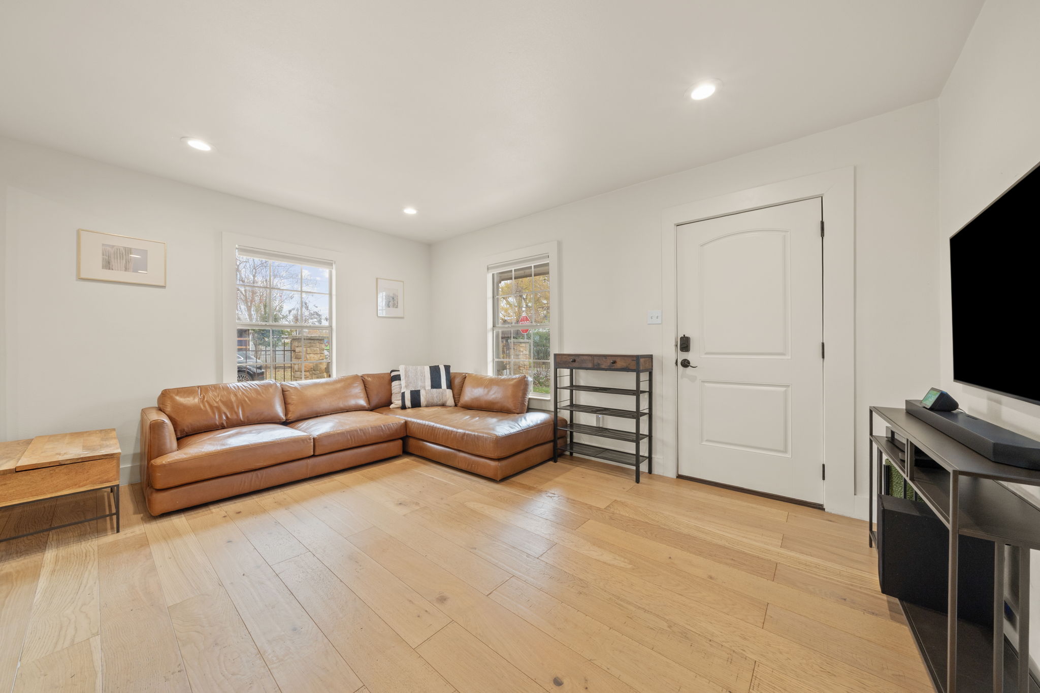 912 Mansell Avenue Austin, TX 78702 - Photo 3 of 37 Living room featuring recessed lighting and light wood-style floors