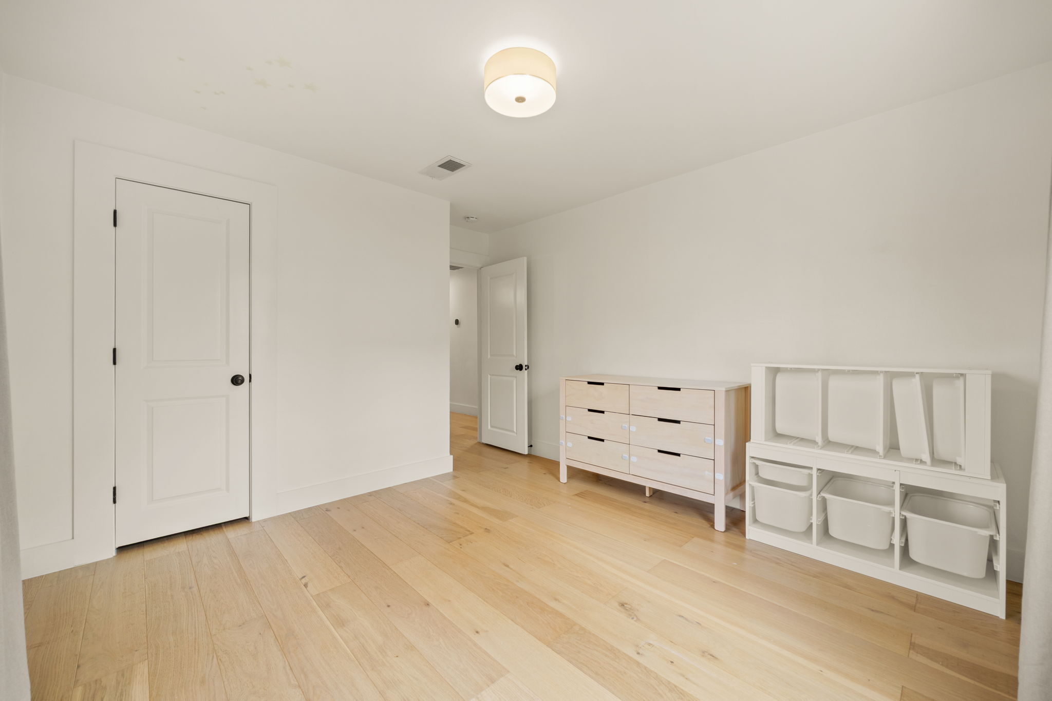 912 Mansell Avenue Austin, TX 78702 - Photo 33 of 37 Unfurnished bedroom with light wood-type flooring